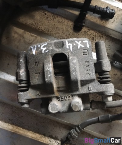 Суппорт задний левый митсубиси Лансер 10