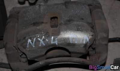 Суппорт передний левый Ниссан икстреил т31